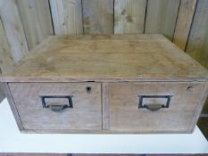 An oak chest of two drawers