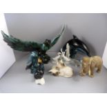 A quantity of animal figures to include a Sylvac Elephant, Poole Pottery Dolphin and Otter, Royal