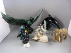 A quantity of animal figures to include a Sylvac Elephant, Poole Pottery Dolphin and Otter, Royal
