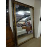 A Large mirror with black and gilt Frame