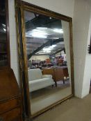 A Large mirror with black and gilt Frame