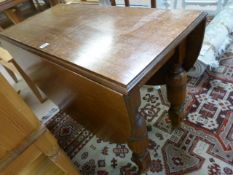 An oak dropleaf table