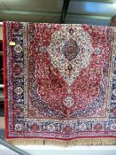 Red ground Kashmir rug