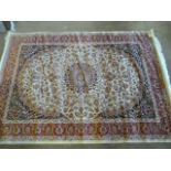 A Beige ground Keshan carpet 1.90 x 1.40