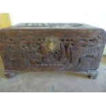 A Chinese Camphorwood chest with heavily carved inset decoration