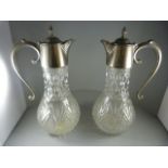 A Pair of Claret Jugs with silverplate tops and handles