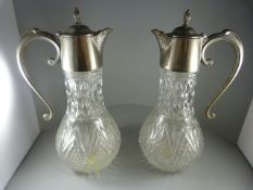 A Pair of Claret Jugs with silverplate tops and handles