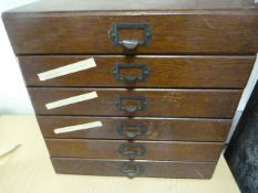 An oak specimen chest of six drawers