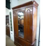 A victorian Mahogany wardrobe with mirrored door