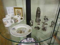 A quantity of Spelter ornaments and Beatrix potter china etc