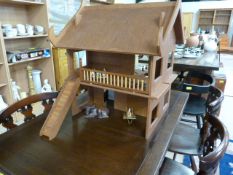 A Thai style dolls house and contents