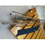 A quantity of various vintage fishing rods