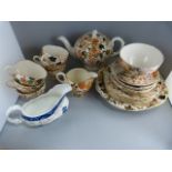 A Part Couldron Tea Service and a Royal Doulton 'Willow Pattern' Cream pourer