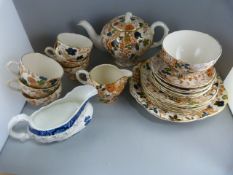 A Part Couldron Tea Service and a Royal Doulton 'Willow Pattern' Cream pourer