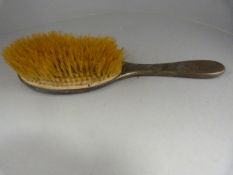 A Hallmarked silver dressing table brush