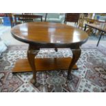 Oval extending mahogany dining table (winder in office)
