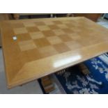 Parquet top rectangular table on heavily carved legs