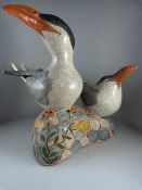 A Raku glazed figure group of Common Terns by Jennie Hale