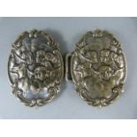 Silver belt buckle (possible nurses) depicting angels in clouds. Hallmarks visible but faded.