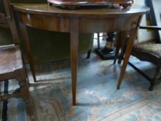 A large mahogany half moon table