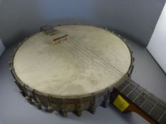 An Unmarked four string banjo - with mother of pearl inlay on fretboard (some inlay missing)