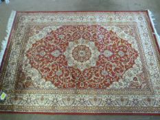 A Red ground Keshan carpet 1.90 x 1.40
