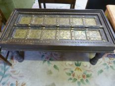 A Coffee table with brass decorations