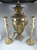 A Copper Samovar and a pair of brass candlesticks