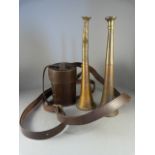 A Pair of hunting horns and a leather case containing six hunting cups.