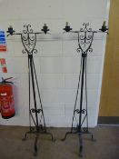 A Pair of cast iron candelabras