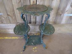 A Three tier cast iron plant stand
