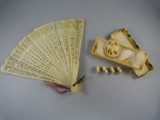 A Worked ivory hand held fan and an elephant hanging pendant, with 4 carved elephant figures