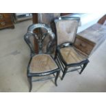 Two ebonised wicker seated chairs one with pearl inlay