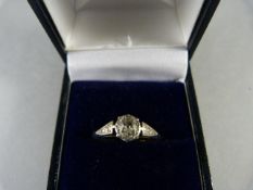 An 18ct Gold Diamond Solitaire set in Platinum