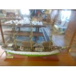 A Model ship in case - Danmark. The Danmark is a full-rigged ship owned by the Danish Maritime
