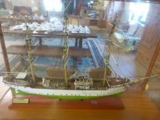 A Model ship in case - Danmark. The Danmark is a full-rigged ship owned by the Danish Maritime