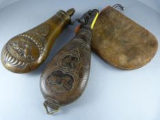 A copper powder flask with a leather shot flask both with hunting scenes