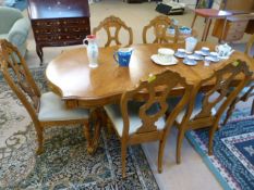 A Dining room table and six chairs with extra leaf