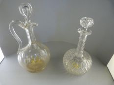 A cut glass decanter and a claret decanter