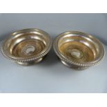 A Pair of Birmingham hallmarked silver Wine Coasters with inset wooden base