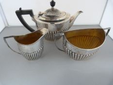 A Sheffield Hallmarked Silver tea service - to include Teapot, Milk jug and Sugar bowl total