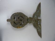 A heavy Brass Nazi Flag staff depicting Swastika in wreath and German eagle atop (approx. 17.5cm