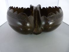 A Coco De Mer double shell believed to have been carved in the Seychelles, in the form of a Basket/