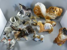 Various donkey ornaments - one marked 'Clovelly' and dog ornaments to include a Beswick 'Pekingese