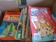 A quantity of Beano annuals, Garfield books and other childrens collectible books etc