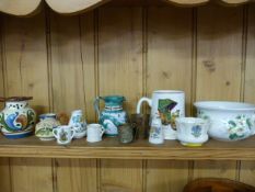 A quantity of crested ware, Torquay ware and Portmeirion etc