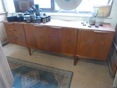 A Macintosh Three door sideboard with three drawers