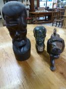 An African carved figure of a lion along with Stone carved tribal man and a wooden carved tribal