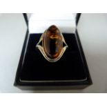 A Silver Ring set with an approx 20mm x 10.3mm oval Amber Stone Size Q (UK) 8 (USA)