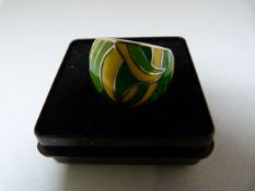 A Silver Ring decorated with green and yellow Enamel. Measuring 16.8mm across the top Size - N (